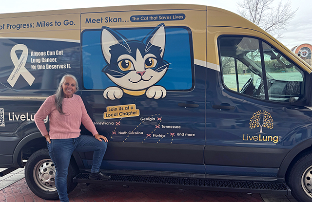 LiveLung founder Dusty Donaldson next to the organization's Skan Van, which features the cartoon cat mascot and promotes lung cancer education, early detection, and community support chapters in multiple states.